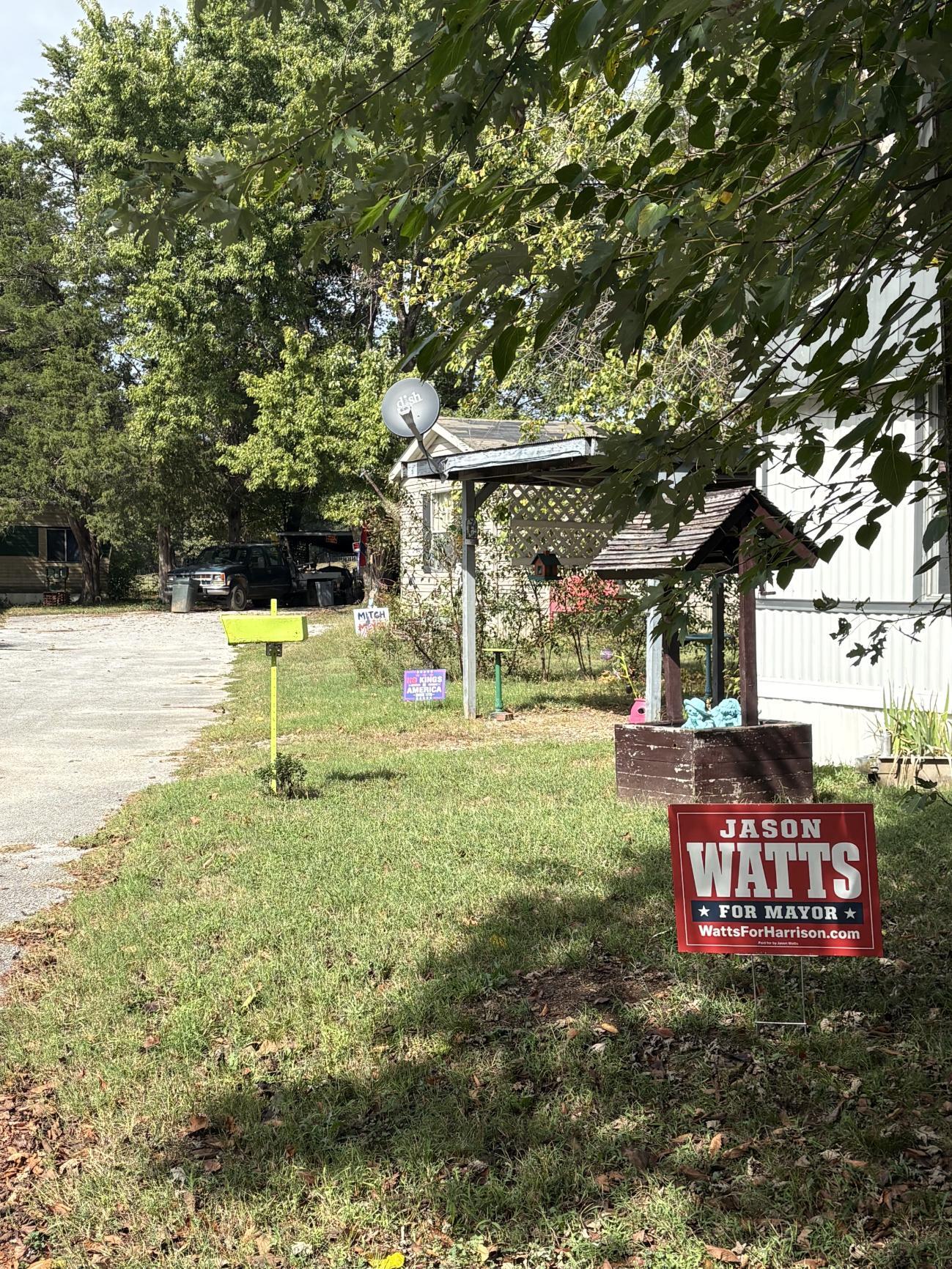 Yard with Jason Watts for Mayor sign and Mitch sign in background